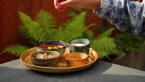 preparing a meal on a traditional tray