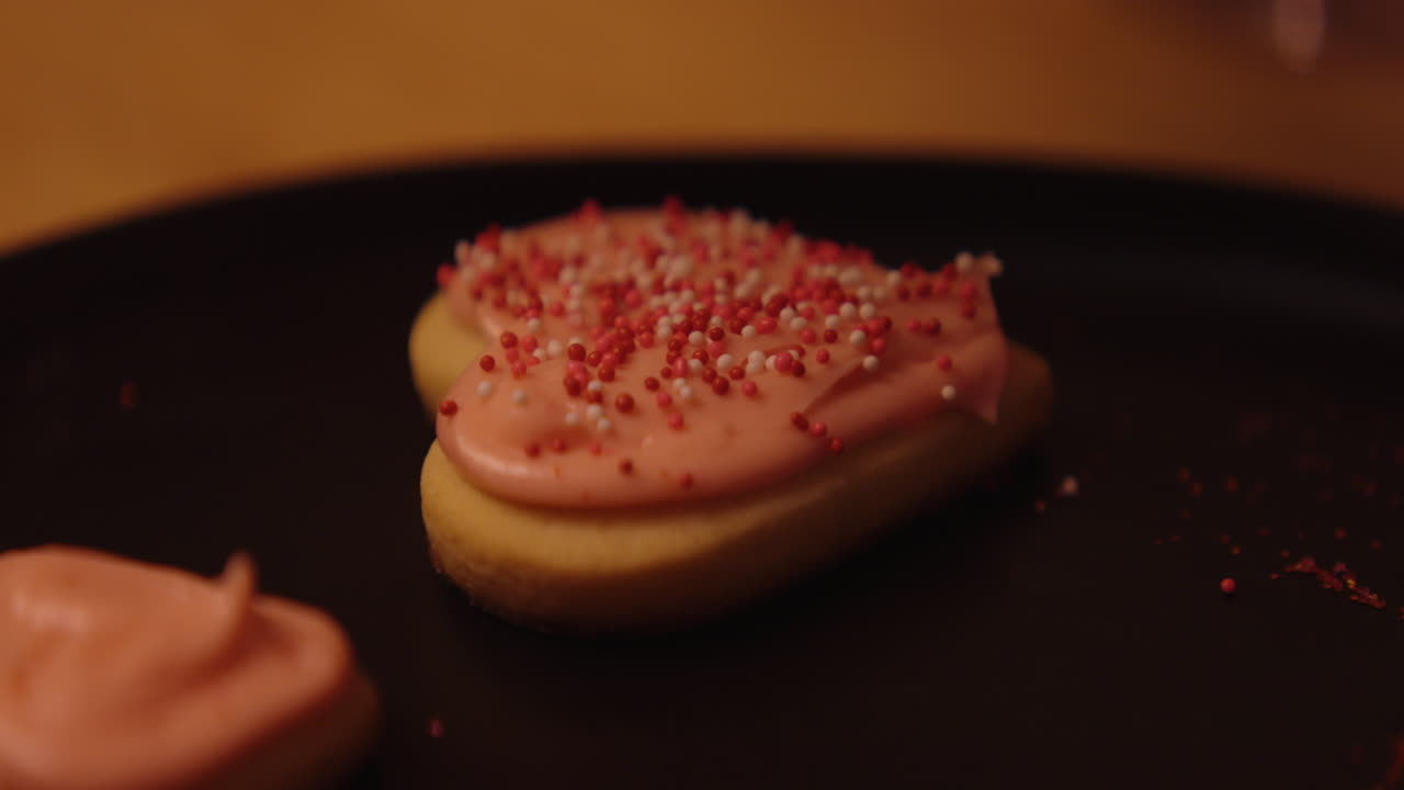 Heart-shaped Cookies with Pink Frosting and Sprinkles