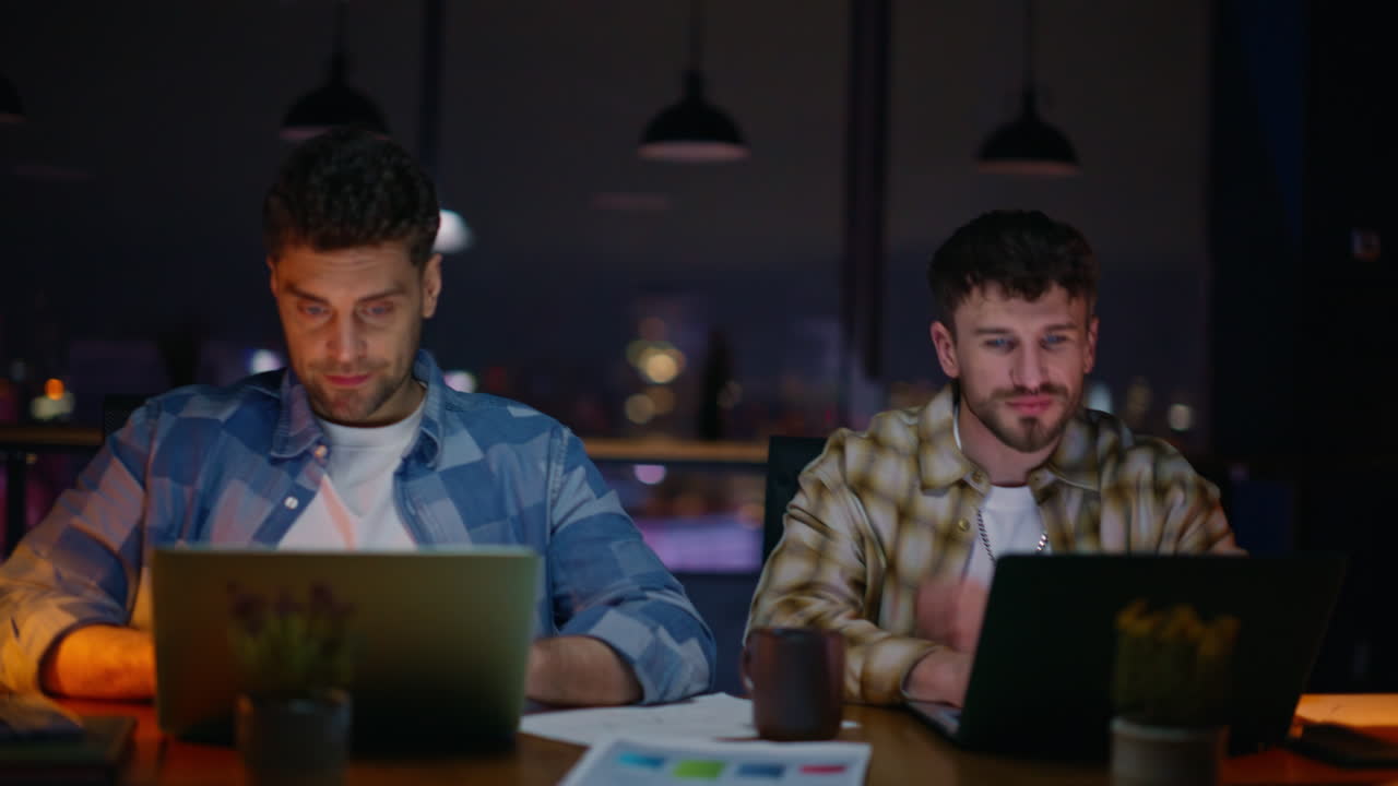 Office coworkers handshaking evening closeup. Successful startupers working