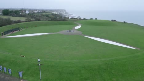 Capel-Le-Ferne-Battle-of-Britain-memorial-garden-propeller-design,-aerial-view-towards-coast