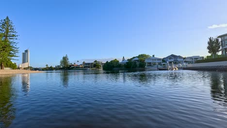 boat cruising through gold coast's scenic waterways