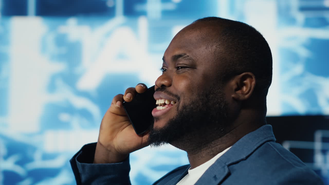 Tech entrepreneur talking on a phone call in an AI environment