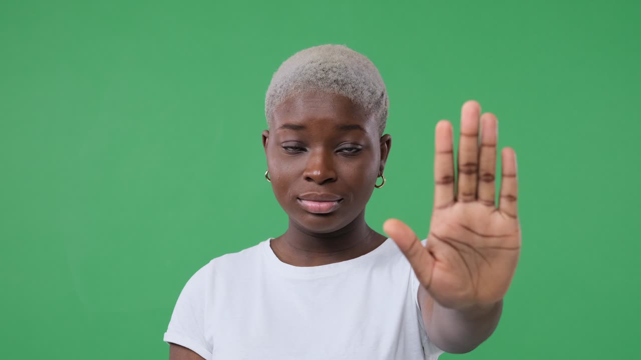 Woman saying no with stop hand sign