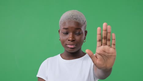 woman saying no with stop hand sign