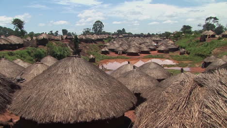 panshot of the rooftops of a traditional village in uganda africa