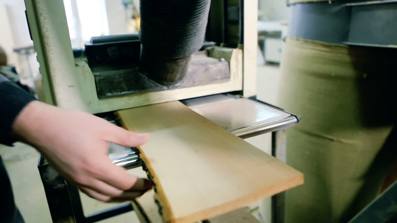 Carpenter working with Industrial tool in wood factory