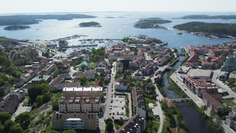 aerial view of a coastal town with marina and islands