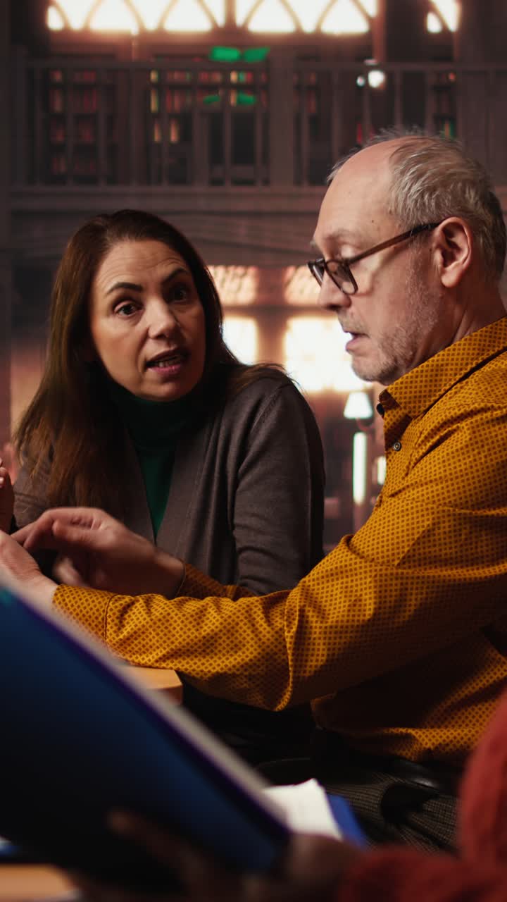 Vertical Video Colleagues disturbing a woman with their loud reading in the library