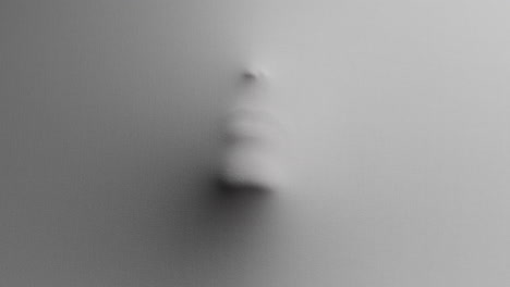 a creepy silhouette of a woman's face appears from the white surface