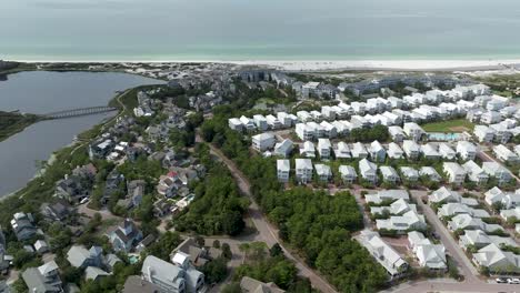 slide to left motion view of cramp creek lake, with community around it , active transit and ocean in the background