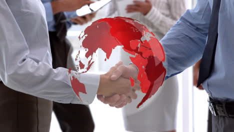 animation of globe over businessman handshake