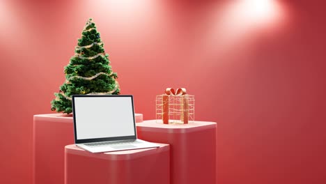 Laptop,-Christmas-Tree,-and-Wrapped-Gift-on-red-background