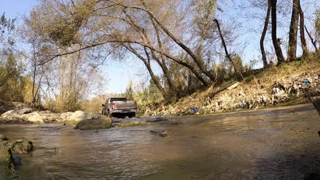 Car-running-through-water-close-up