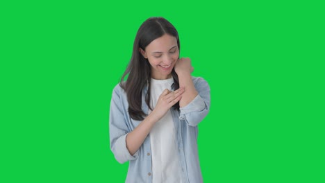 happy indian girl removing the bandage green screen