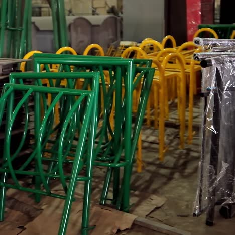metal construction parts. colorful equipment for fence inside the warehouse. disassembled parts of fence.