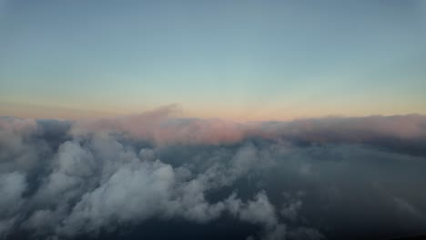 Flying-across-a-cold-winter-sky-at-sunset,-as-seen-by-the-pilots-of-an-airplane-during-a-real-flight-over-Mallorca-Island,-Spain