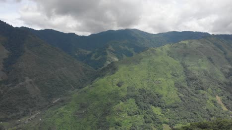 4k aerial backward dolly reveal shot of one of the largest village tuensang of nagaland, india