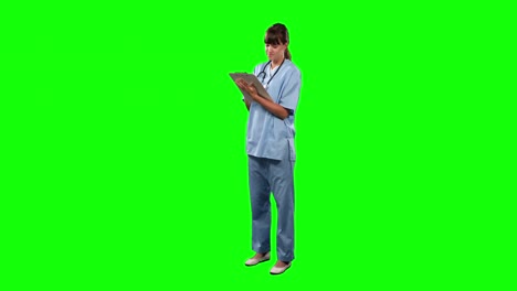 Front-view-of-doctor-watching-some-results-with-green-screen