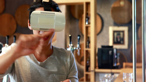 Man-using-virtual-reality-headset-in-restaurant-4k