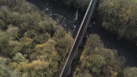 old welsh pontcysyllte aqueduct waterway aerial view rural autumn woodlands valley birdseye over fly