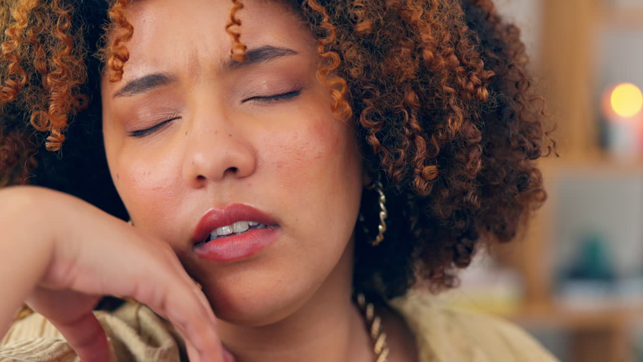 Black woman, stress and tired on couch