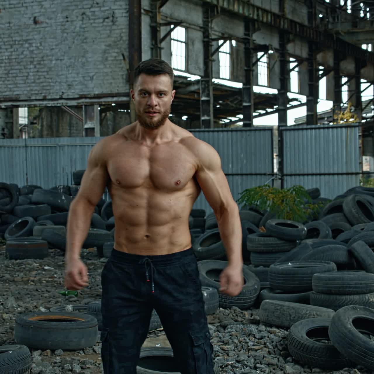 Handsome muscular man posing outside