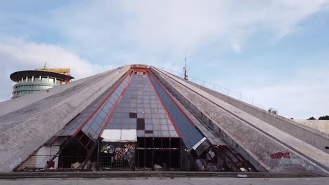 pyramid of tirana, concrete and glass socialistic structure, former museum and tourist attraction