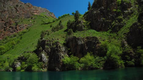 small mountain lake of  blue color urungach. located in uzbekistan, central asia. 4 out of 10