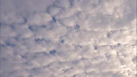 white cotton candy clouds moving in the sky fully covered time lapse