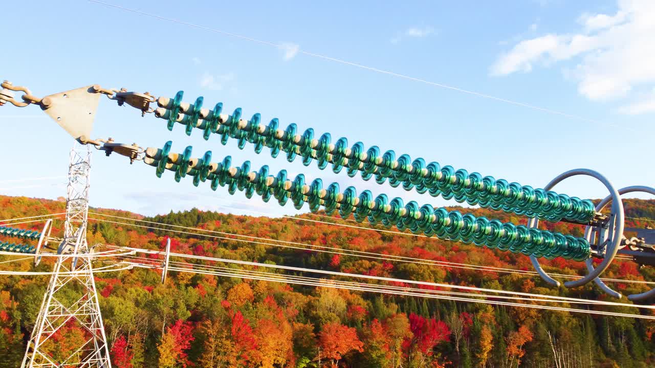 Drone shot of transmission line towers in the mountains of Montr&eacute;al, located in Qu&eacute;bec, Canada