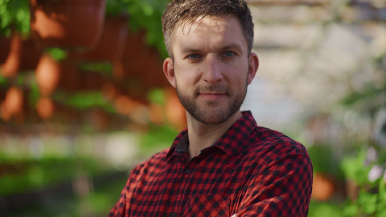 Young Farmer Happy in Greenhouse