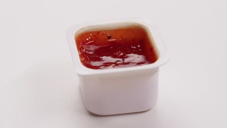 single-serve packet of chili sauce