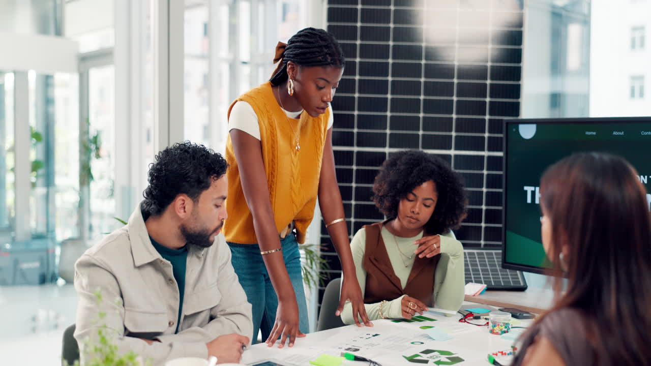 Diverse Business Team Discussing Sustainable Project in Modern Office