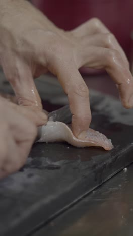 preparing fresh fish on a cutting board