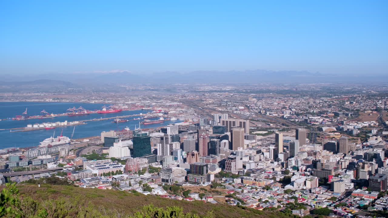 Panoramic view of Cape Town port and city bowl toward Table Mountain, pan shot