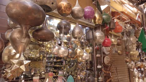 view of souvenirs and old items in a street shop, famous marketplace in luxor, egypt