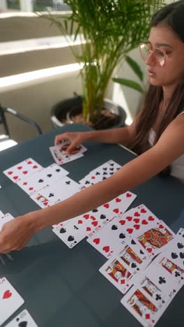 woman playing cards on a patio