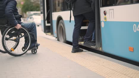 person with a physical disability enters public transport