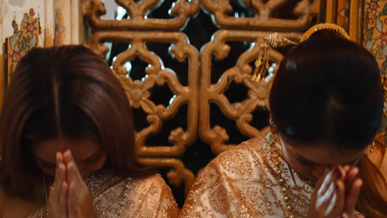 Two women in traditional Thai attire