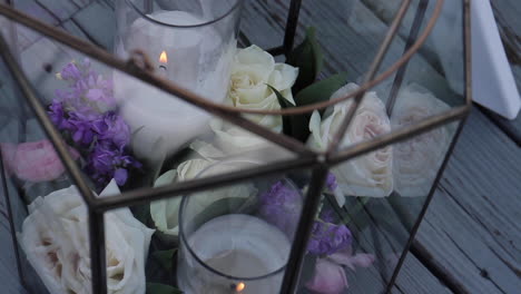 elegant wedding centerpiece with candles and flowers