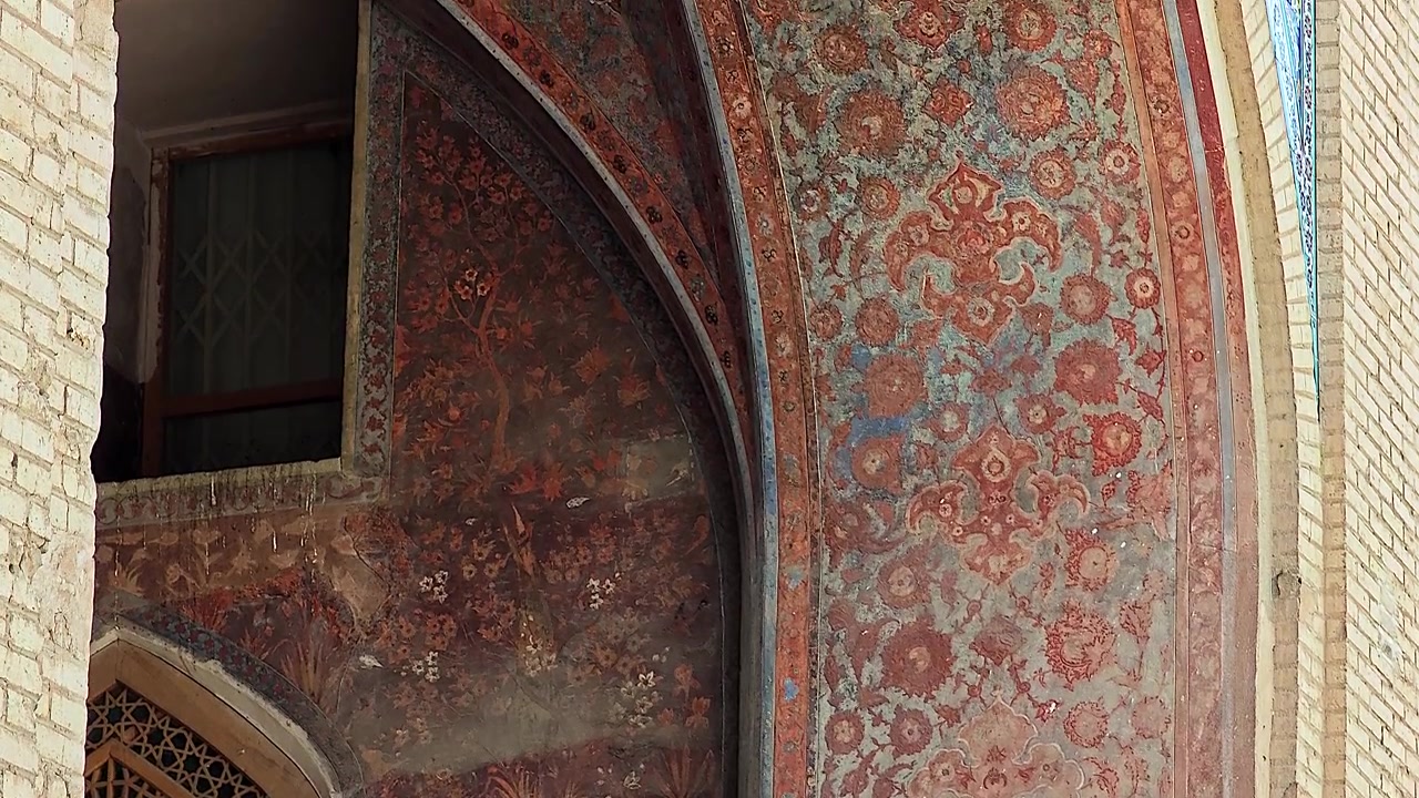 Intricate Persian Fresco Painting on Historic Archway
