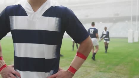 Animation-of-confetti-over-male-rugby-players-during-match-at-stadium