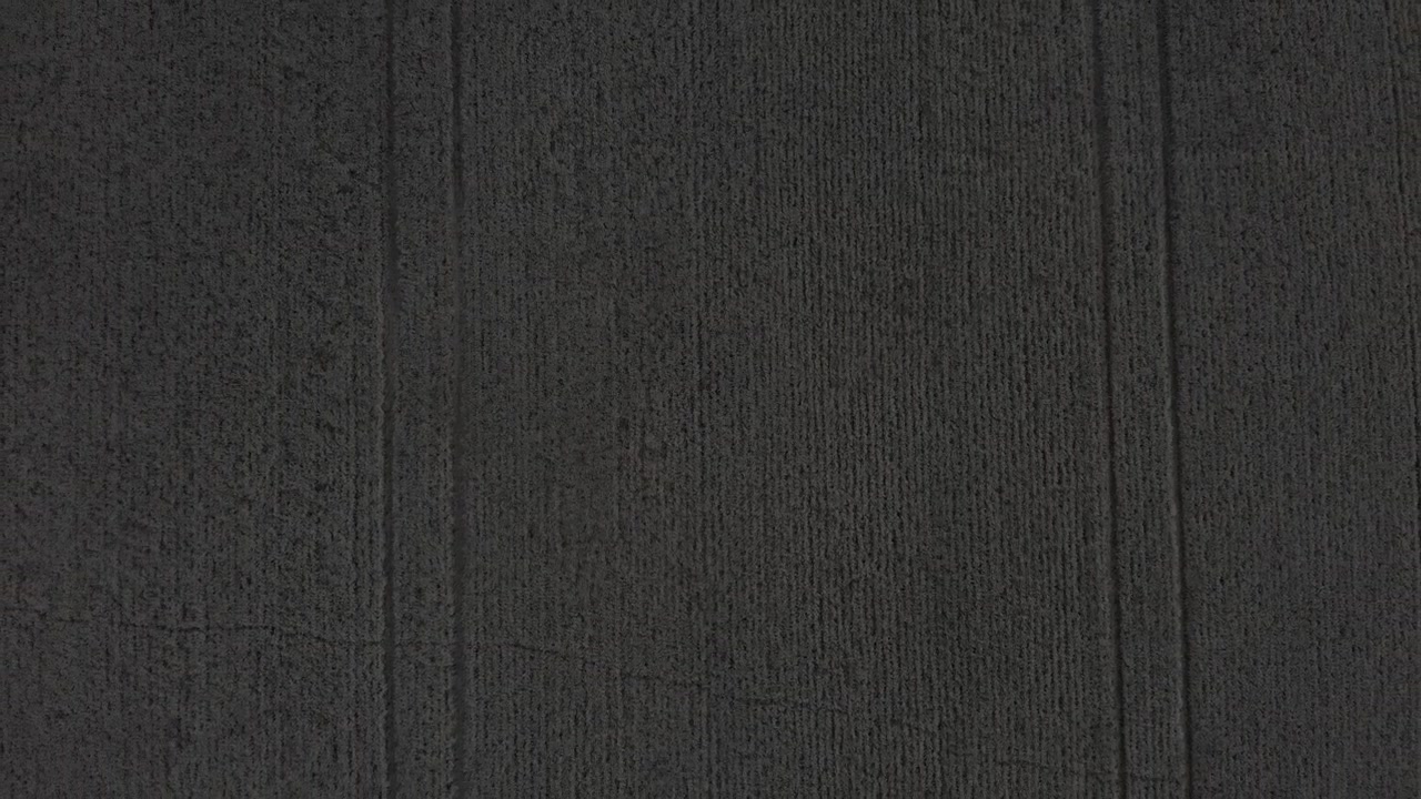 High aerial flight of a harvested wheat field in Alberta Canada