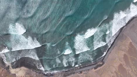 Birdseye-Aerial-View,-Atlantic-Ocean-Waves-Breaking-on-Beach-of-Sao-Vicente-Island,-Cape-Verde