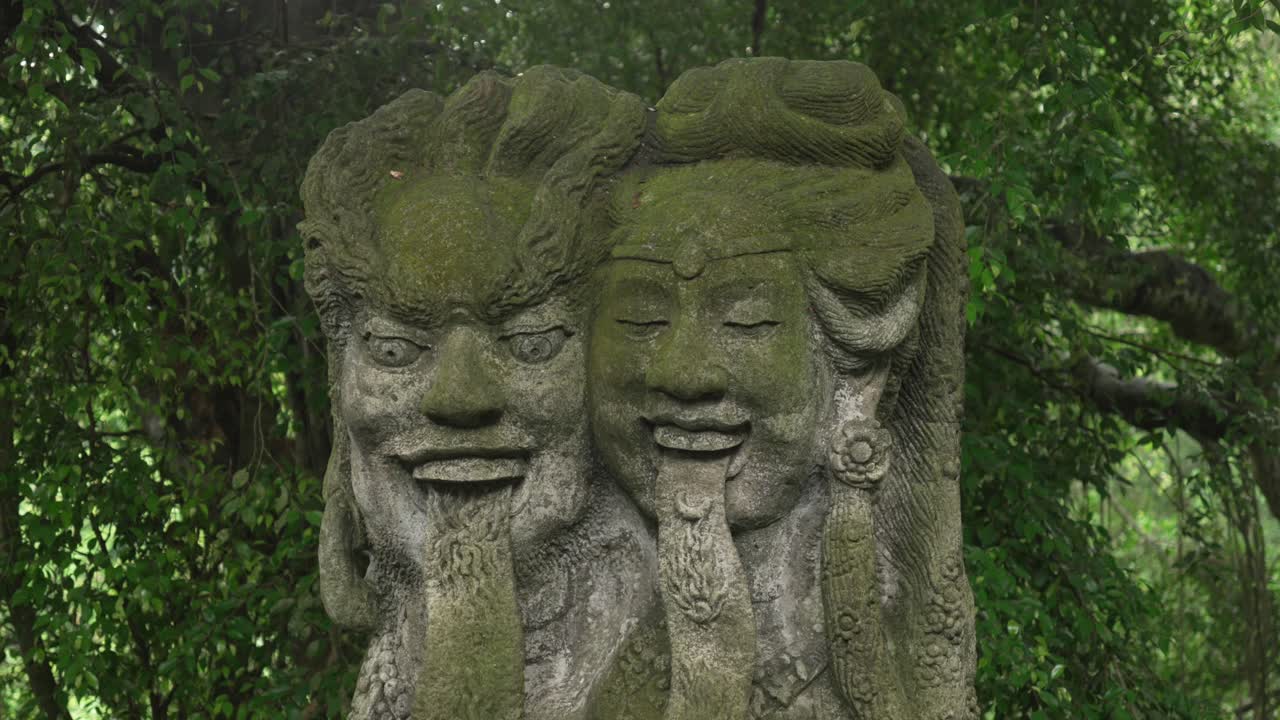 Traditional Balinese Hindu statues carved into stone Bali Ubud Indonesia