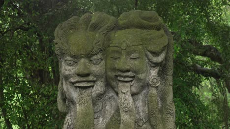 Traditional Balinese Hindu statues carved into stone Bali Ubud Indonesia