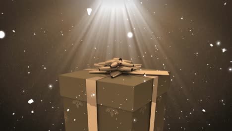 animation of christmas present amd snow falling on brown background