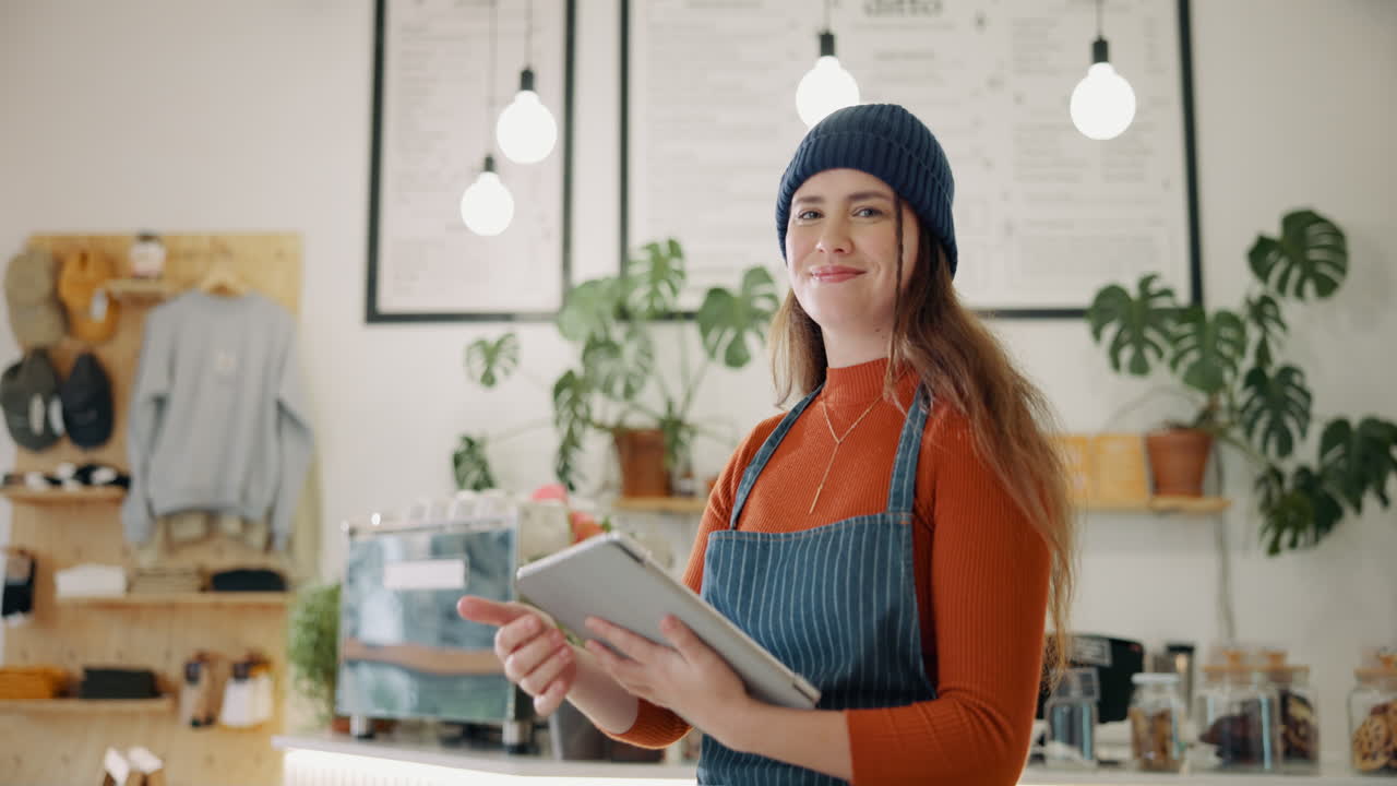 Portrait of a smiling woman working at a cafe