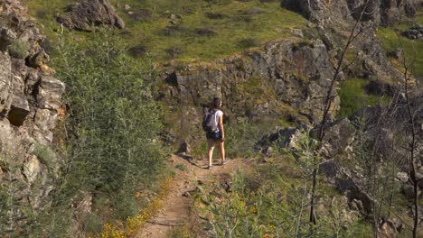 women in penedo furado passadico walkway landscape in vila de rei, portugal