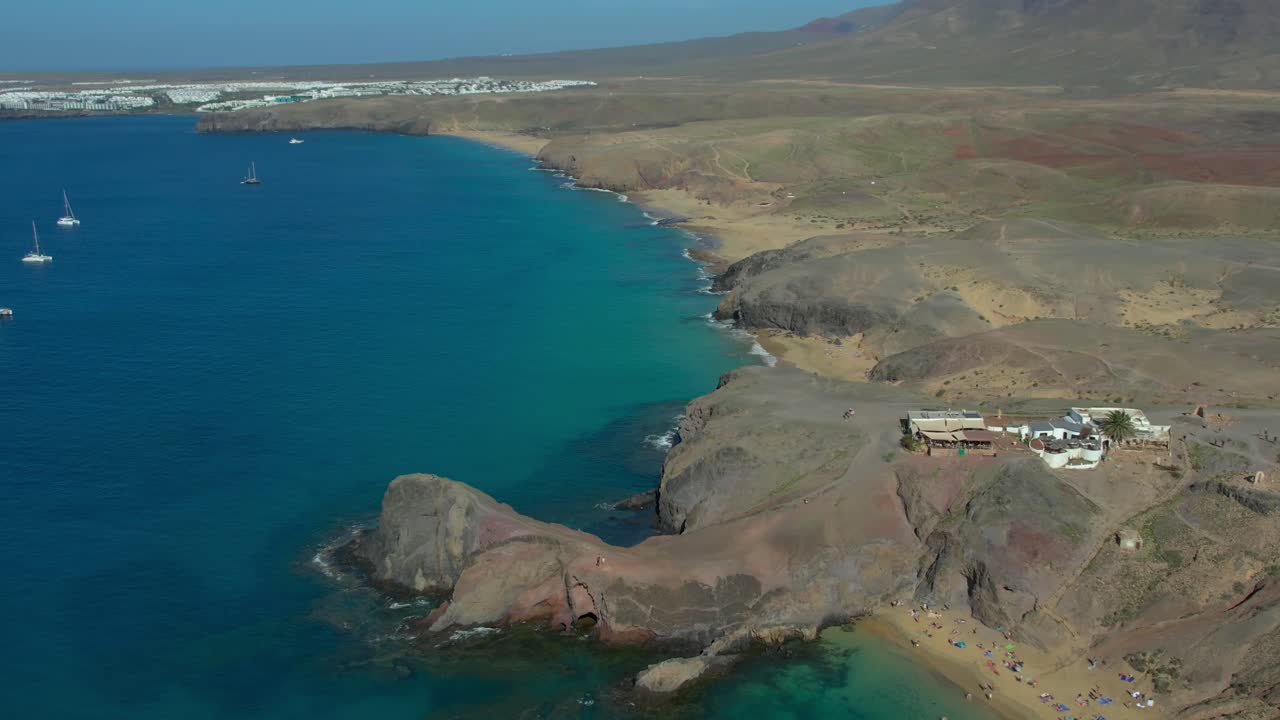 Aerial drone view of mountain sea and volcanoes in Lanzarote, Canary Islands, Spain